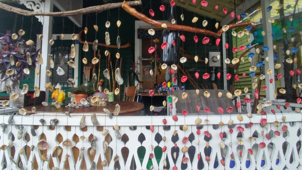 Scene of hanging colorful objects before a storefront.