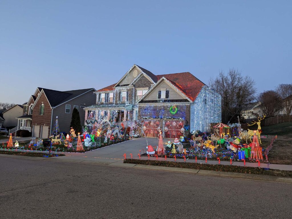 Suburban home with multiple Christmas decorations