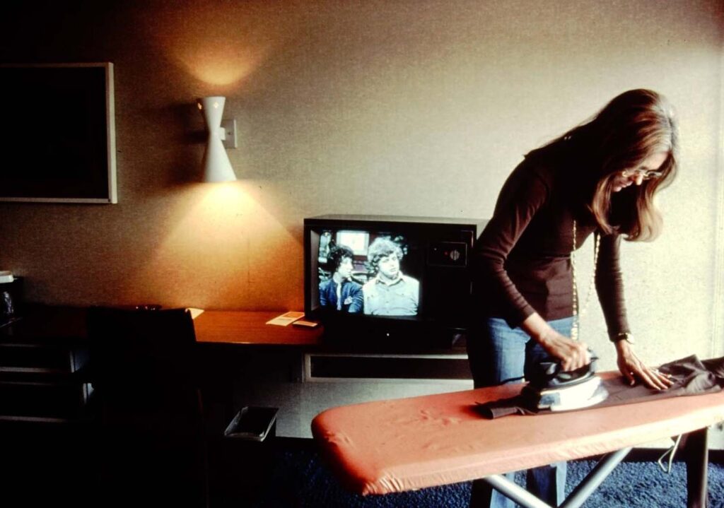 Gloria Steinem doing her ironing before a speech at John Deere Headquarters in Moline, 1995